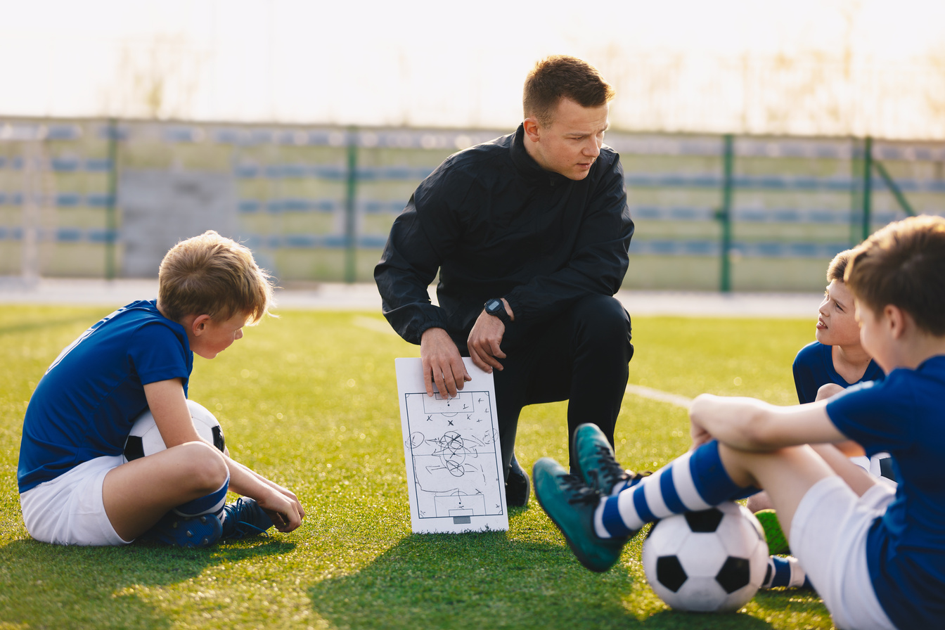 Soccer Coach Coaching Children